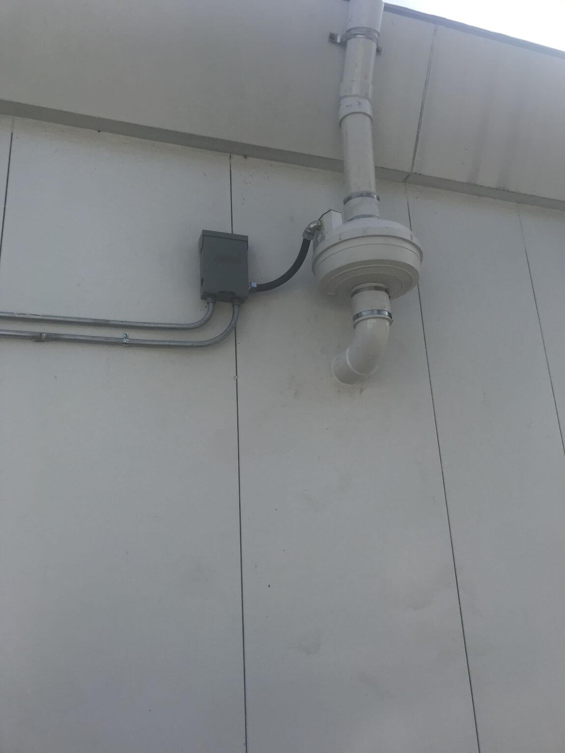 Exterior roof line vent for vapor intrusion mitigation system on home